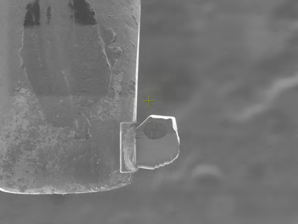 Fig. 2d: Sample welded to a standard TEM grid using carbon deposition